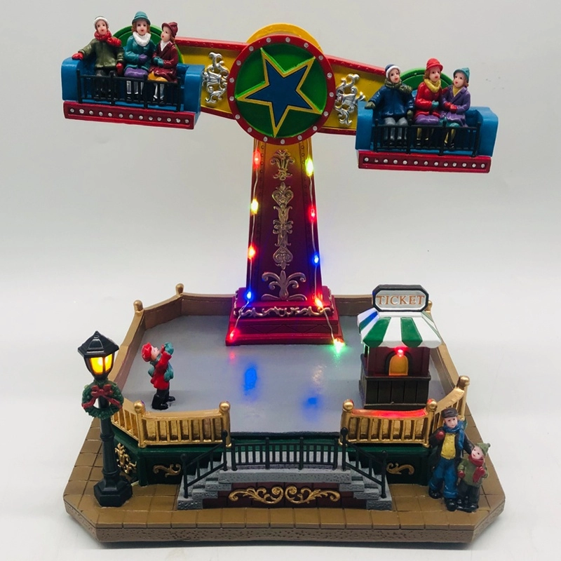 Φωτισμένος χριστουγεννιάτικος παιδότοπος με τα παιδιά που πετούν